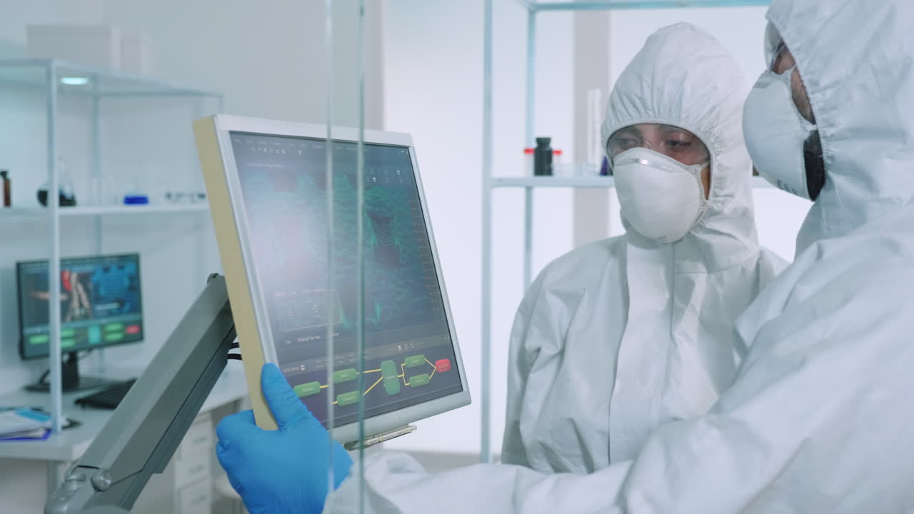 bioquímicos en su totalidad escribiendo en pantalla digital la composición de la vacuna