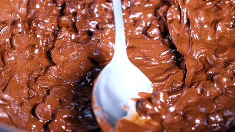 spoon stirring melting chocolate chips smoothly