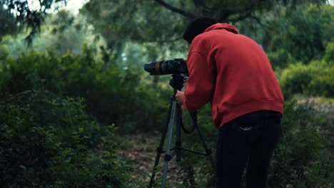 young boy photographer in the jungle