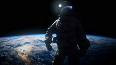 astronauta en el espacio exterior con el telón de fondo del planeta tierra. imagen de la tierra proporcionada por la nasa
