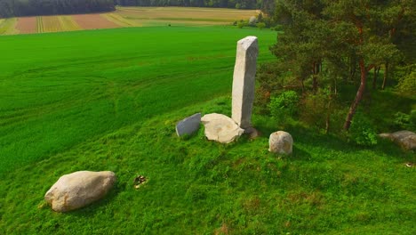 camera flight around ancient stone monument. menhirs and dolmens near tesovice. famous place for every year rituals of fertility treatment. mysterious landmark in czech republic, central europe.