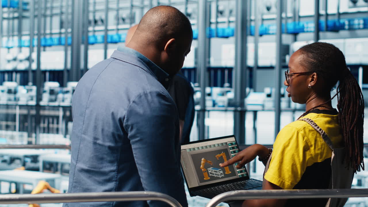 Engineers talking with manager overseeing smart photovoltaics factory