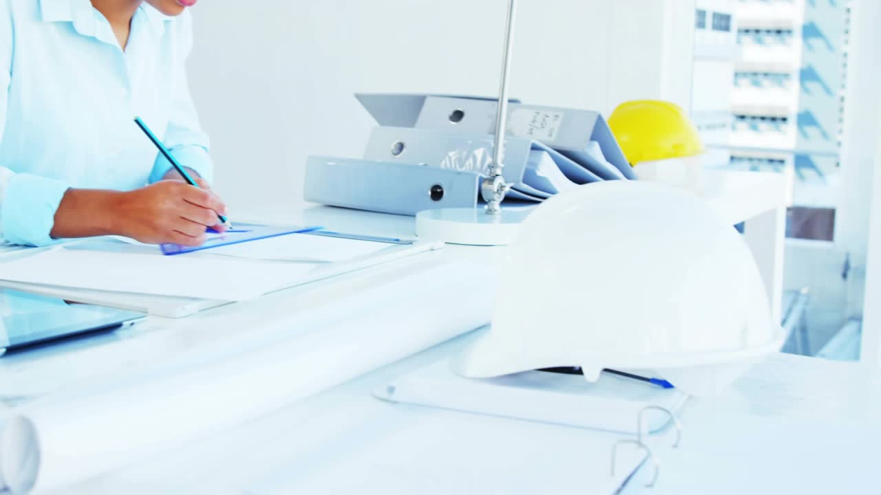 Pullback showing woman writing flipping pages finishing office forms with yellow icons overlapping