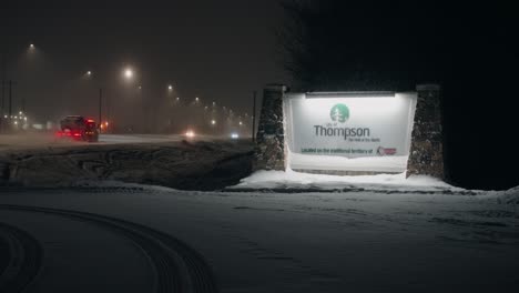 Night-Time-Morning-4K-Shot-Glowing-Car-Traffic-Highway-Entry-Welcome-Sign-City-Town-Northern-Reservation-Community-Treaty-Five-Hub-of-the-North-Nickel-Mine-Thompson-Manitoba-Canada