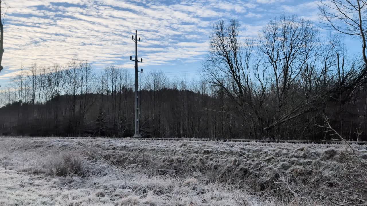 Sweden, Munkedal Updating Railway after new NATO directive beacuse of the russia ukraine war. Putting up new posts and cutting down trees. Shot in 4k 60fps, Rendered in 23,976fps slowmotion