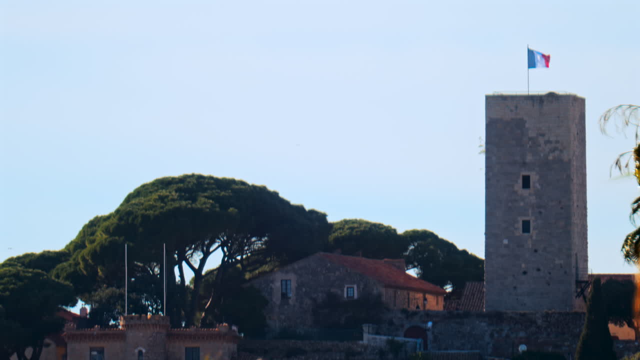 Distant view of the Goya Museum in Castres, France with the french flag on top of it