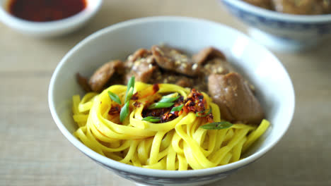 asian stir-fried noodle with pork and chili paste