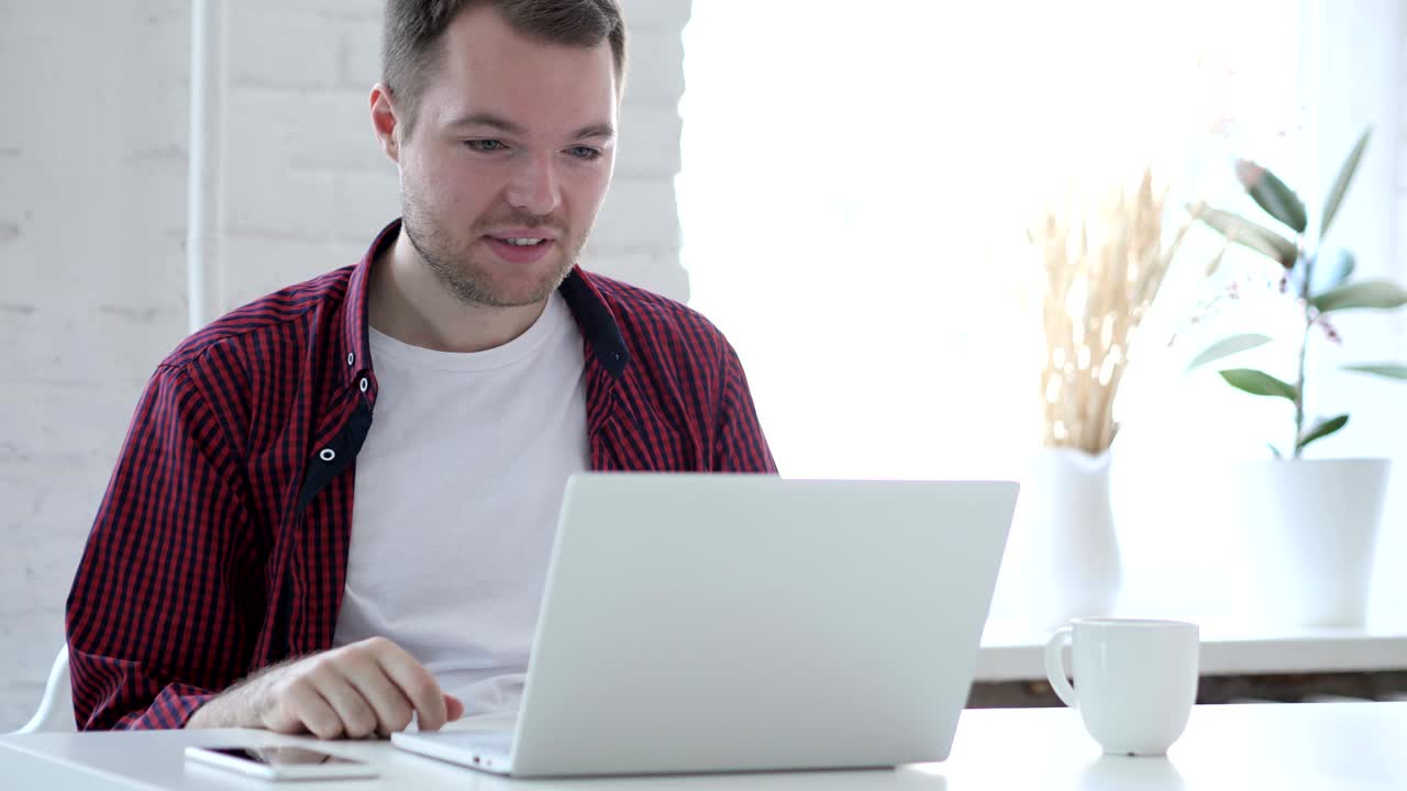 Online Video Chat on Laptop at Work