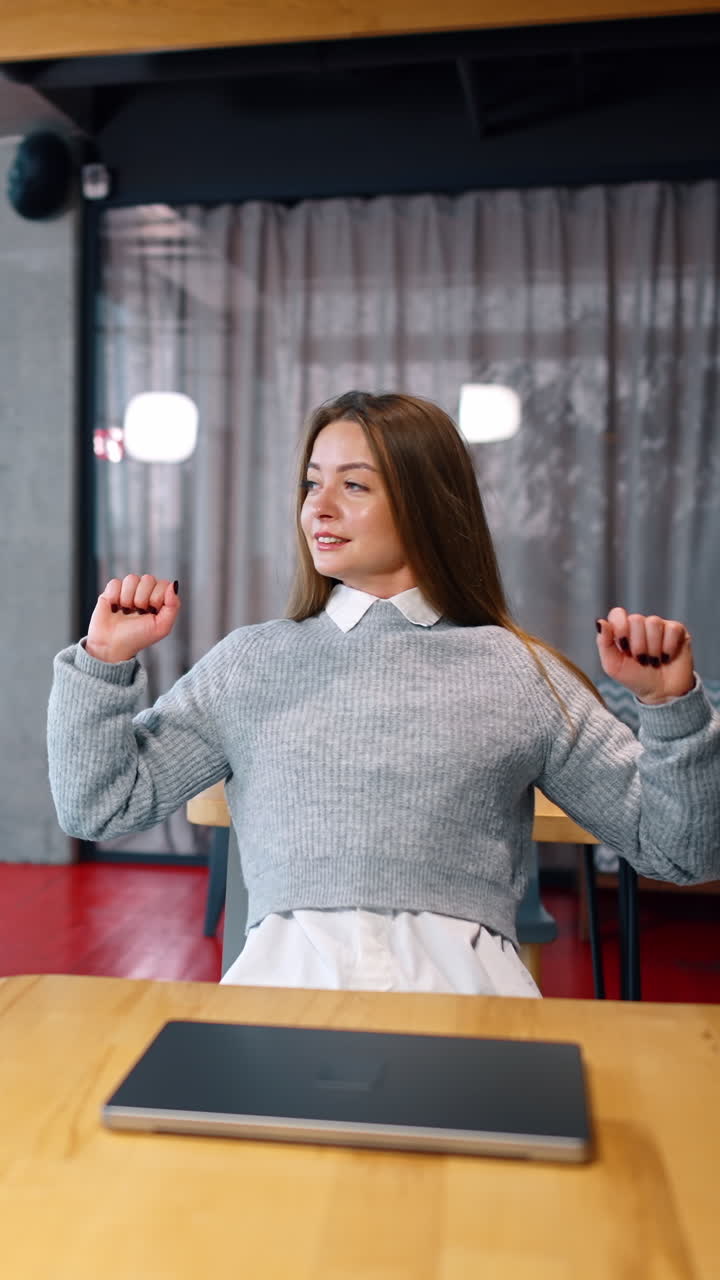 Long-haired woman lying on her laptop tired from work