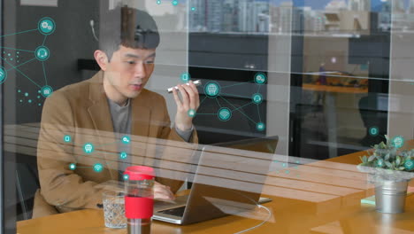 animation of connected icons over diverse man talking on cellphone and discussing with coworker