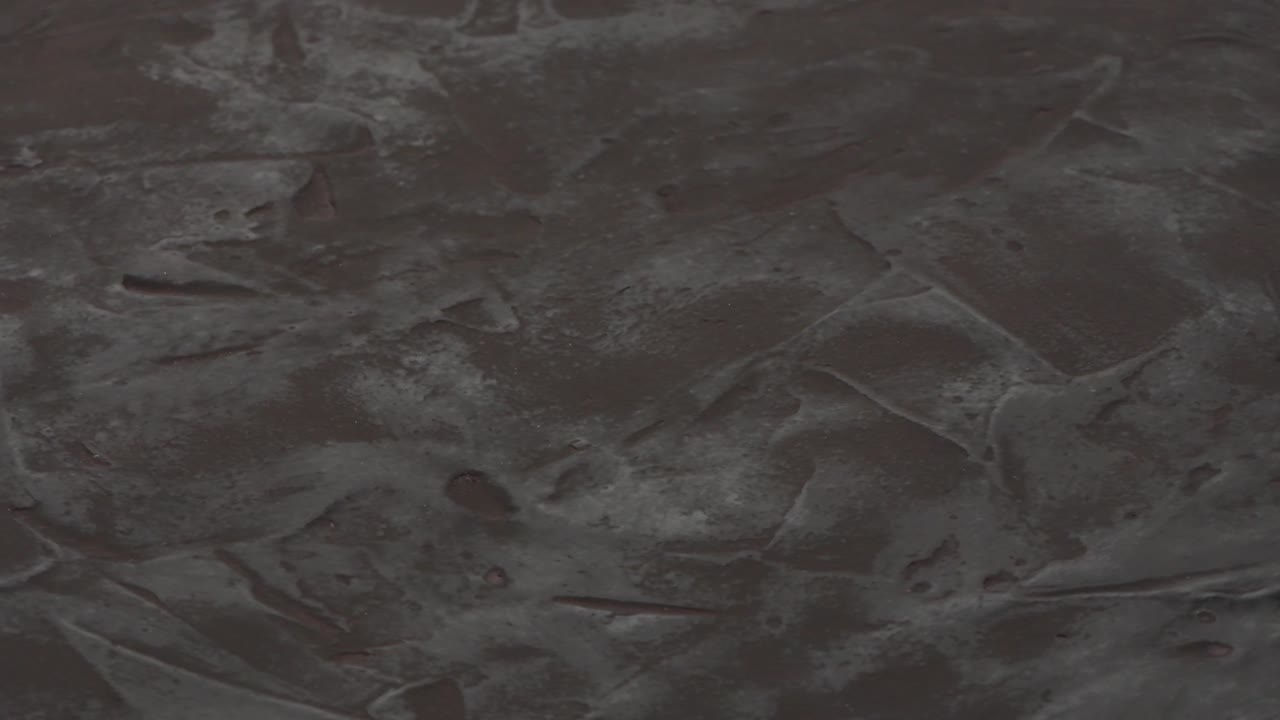 fondo de textura negra. vista lateral. movimiento en bucle. rotación 360.