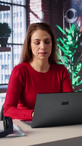 vertical video confident woman solving her tasks on a freelance platform at home