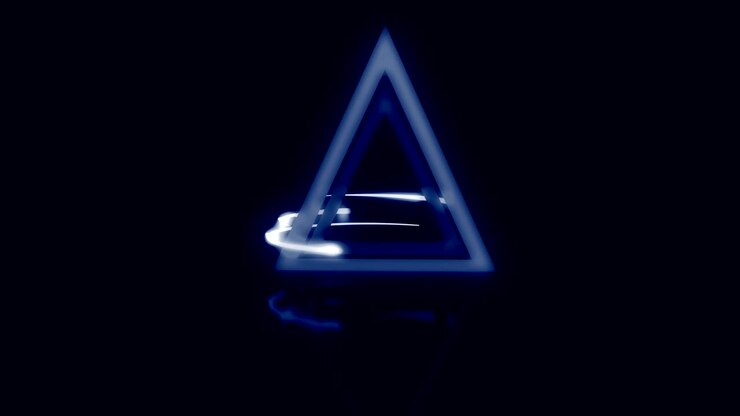 Light rays encircle a glowing abstract triangle.