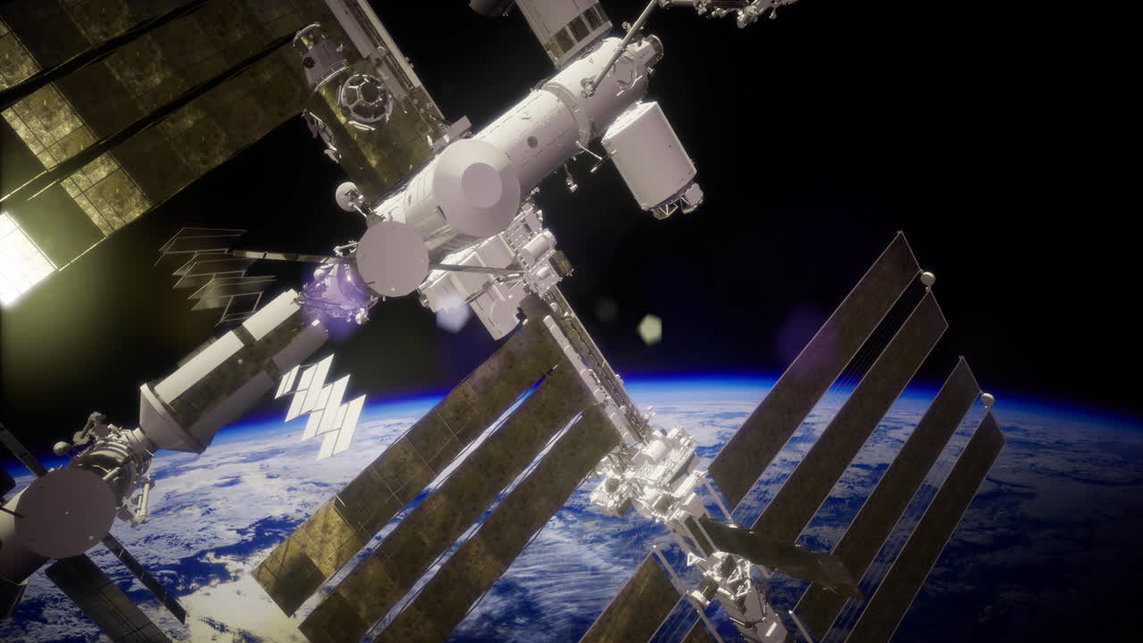 View of international space station orbiting earth during daylight hours