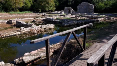 unearth the enigmatic beauty of ancient city stone walls beneath the waters at butrint's archaeological site