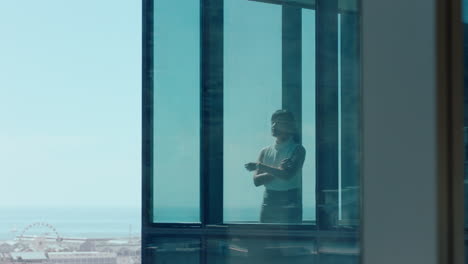 successful asian business woman looking out window proud ceo planning ahead thinking of ideas for future investment strategy corporate manager enjoying leadership career in office