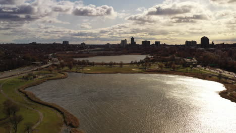 aerial drone view hovering over a lake on a cloudy day