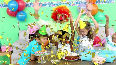 Animation-of-confetti-falling-over-birthday-cake-and-children-having-fun-at-party