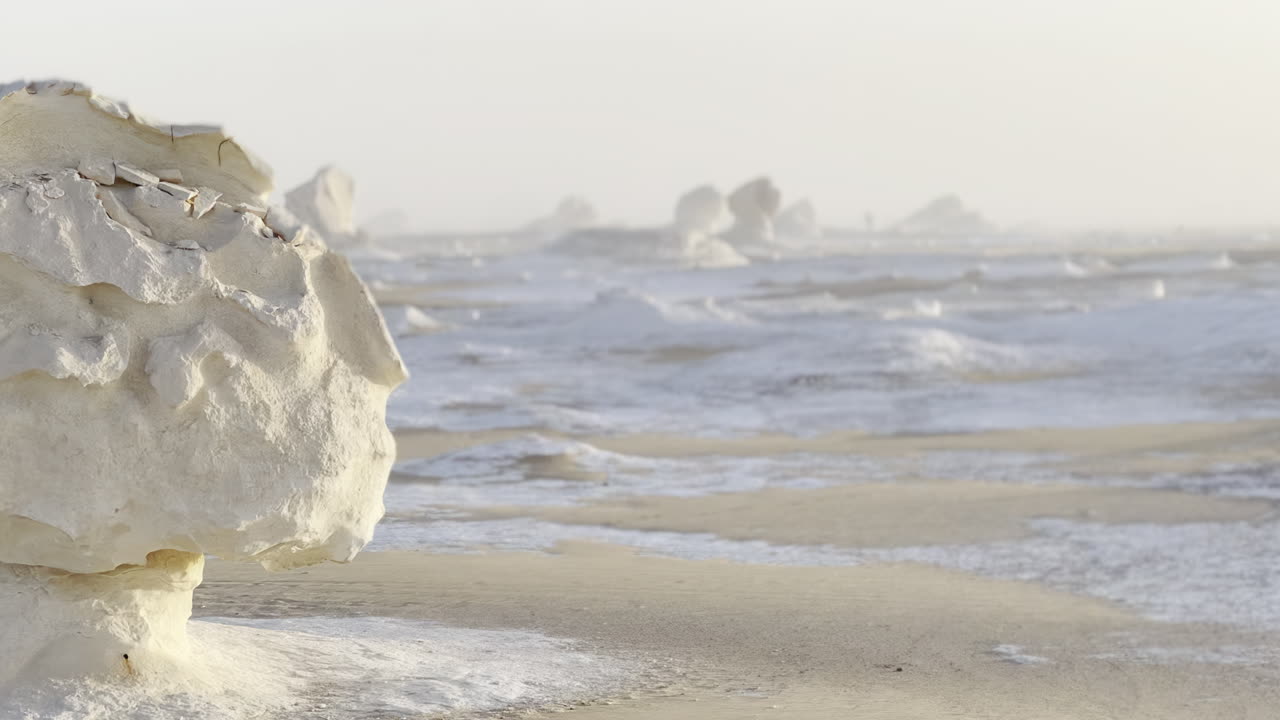The Egyptian white desert adventure tourism with bedouin camping and 4x4 driving through the desert to see rock formation and sand and dust at sunset and golden hour