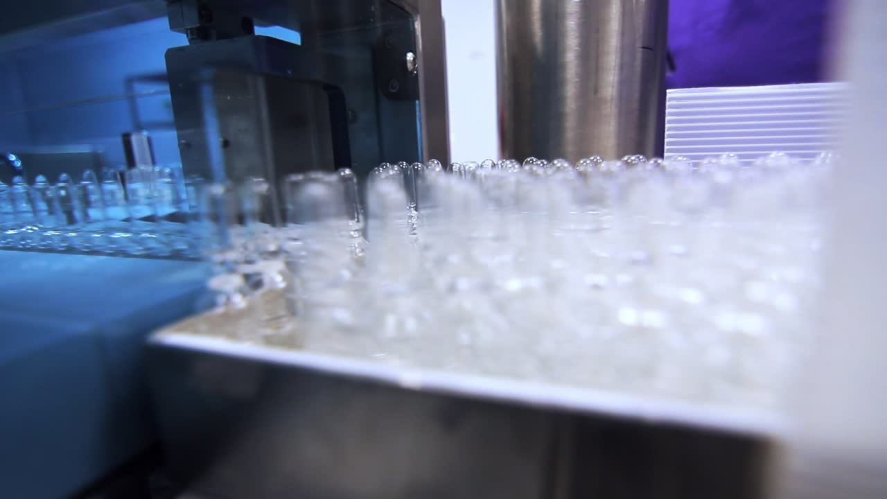 Medical vials on manufacturing line. Pharmaceutical production line at factory