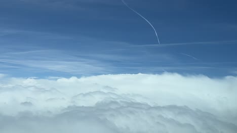 Awesome-view-from-an-airplane-cabin-overflying-a-sea-of-clouds-at-12000m-high