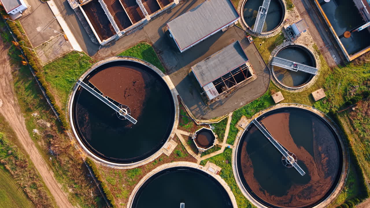 Round reservoirs with sewage waters. Drone flight above the plant for waste water recycling