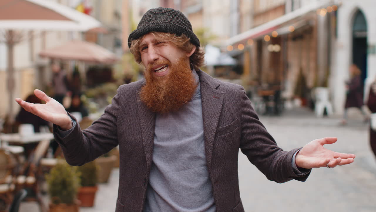 Confused man feeling embarrassed about ambiguous question having doubts no idea in city street