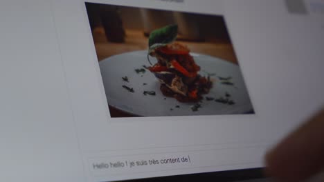 man typing a message into a social media group about food