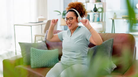 Music-headphones,-dance-and-black-woman-on-sofa