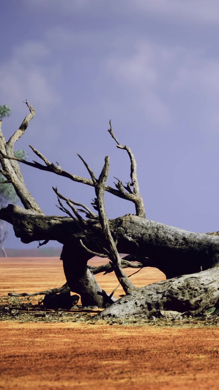De natuur toont een omgevallen boom in een vredig landschap onder een blauwe hemel