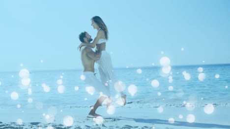 couple enjoying at the beach surrounded by white bubbles effect