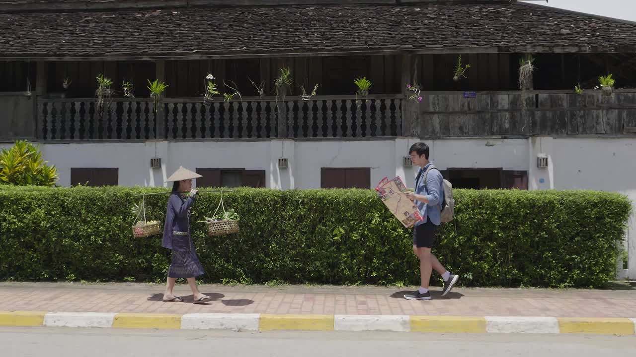 Street Vendor and Tourist in Luang Prabang