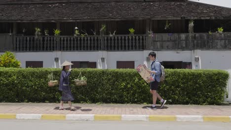 street vendor and tourist in luang prabang