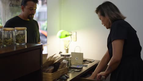 customer and employee interaction at a dispensary counter