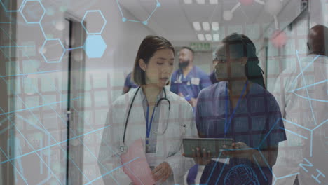 animation of molecular structures and medical data over diverse female doctors talking in hospital