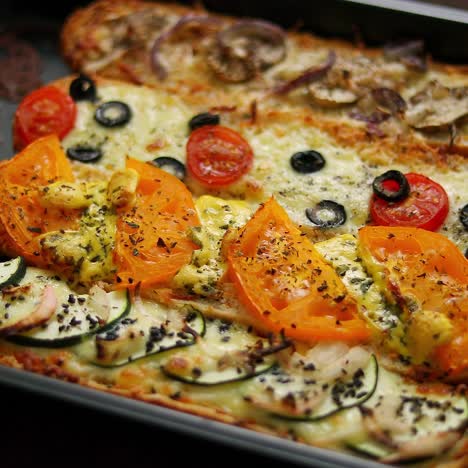 Delicious-hot-sandwich-baguettes-baked-with-tuna--cheese--tomatoes--olives--courgette-and-mushrooms