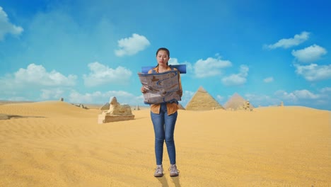 full body of asian female hiker with mountaineering backpack looking at the map then looking around while traveling in pyramid of giza