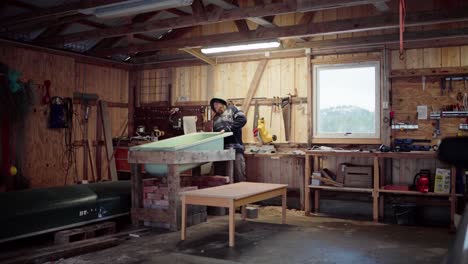 a man is placing the hot tub into the fitted framework support - static shot