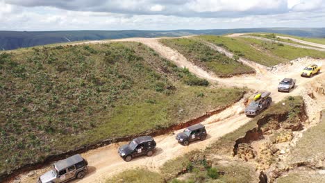 4x4 off road vehicles on rough terrain trail in serra da canastra national park in overland event, minas gerais, brazil