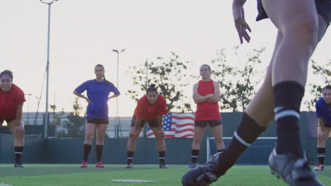 Close-Up-Of-Player-Shooting-And-Scoring-Goal-From-Penalty-Kick-As-Team-Mates-Celebrate