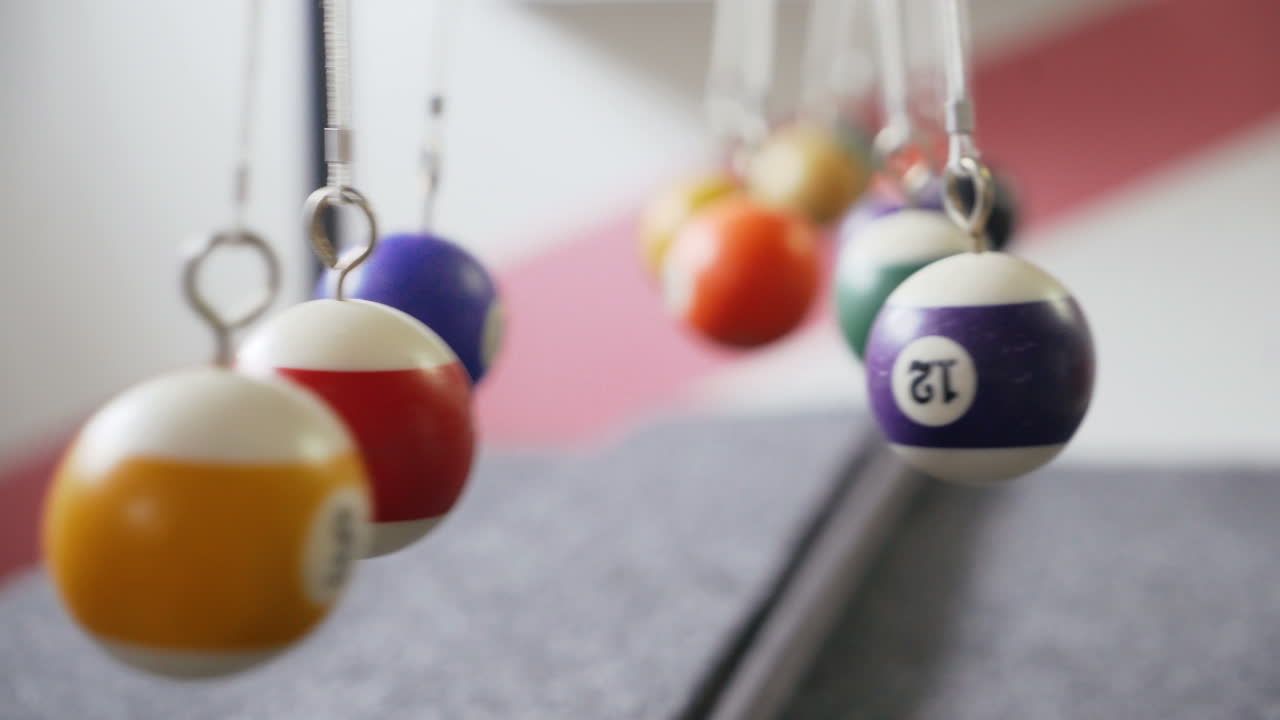 Newton's cradle showing laws of physics in motion. Museum of Science