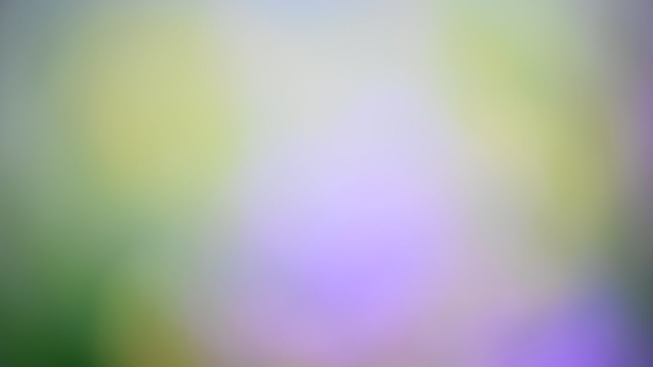 Soft pastel abstract background with green and purple hues
