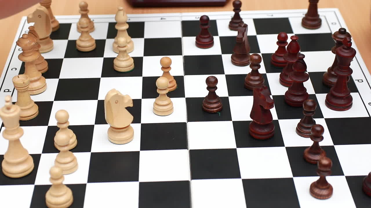 Young people playing chess on large board. Logic developing board games concept. Leisure and hobbies. Close up