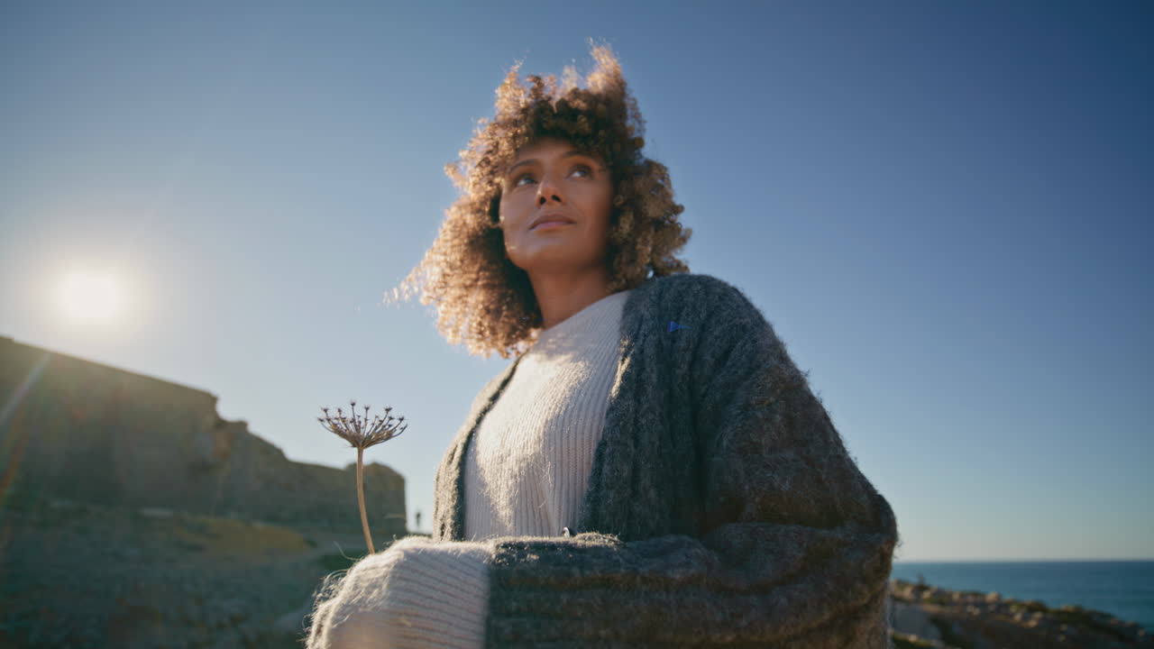 Romantic model resting marine landscape at windy weather zoom on. Dreamy girl