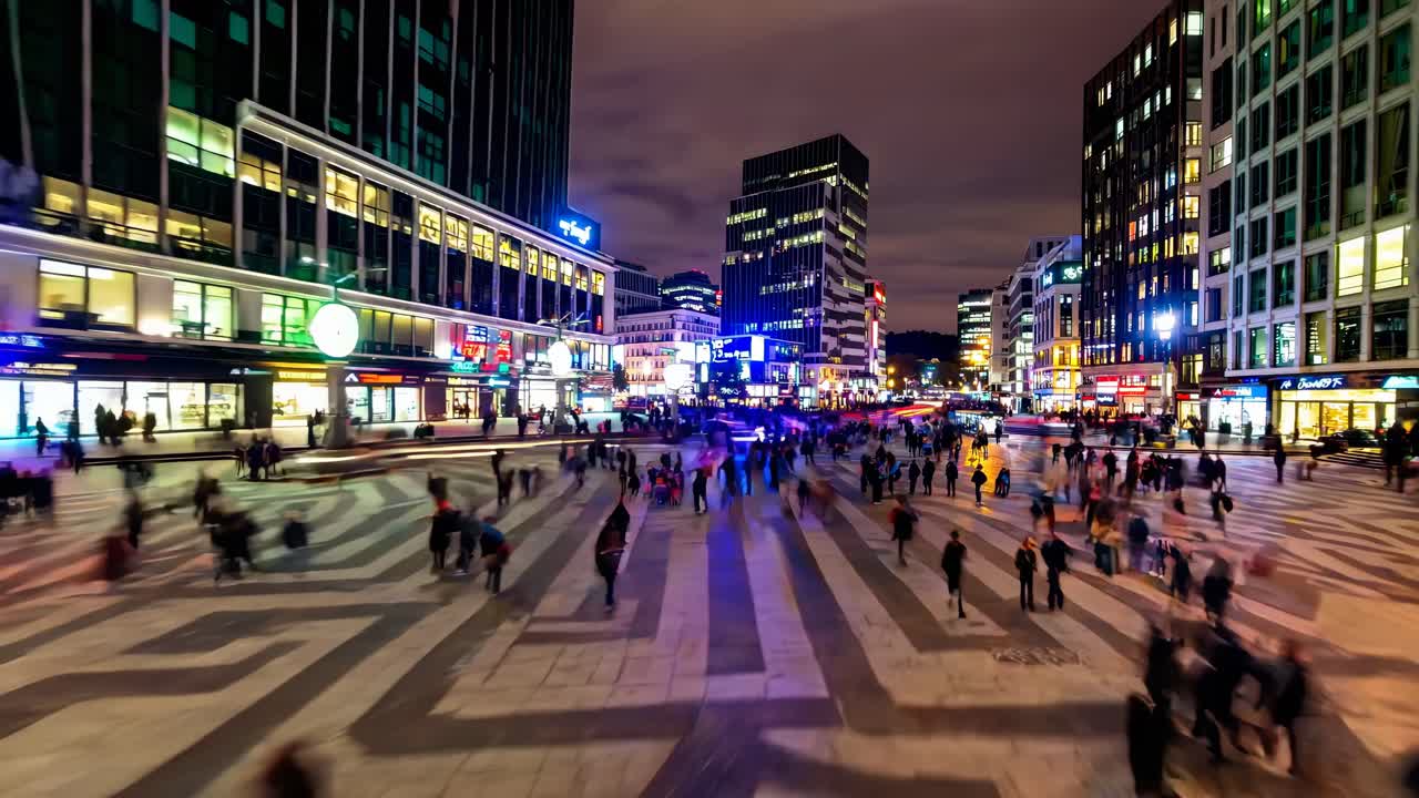 A dynamic cityscape video with a high-angle view, capturing blurred motion of people and traffic