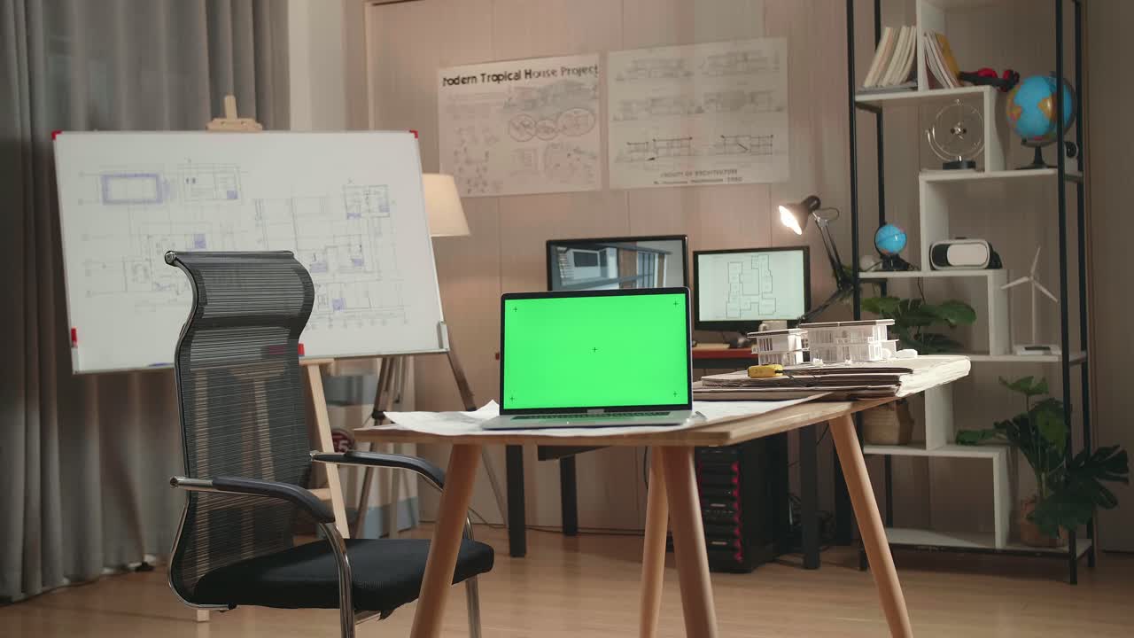 Architect's Workspace with Green Screen Laptop