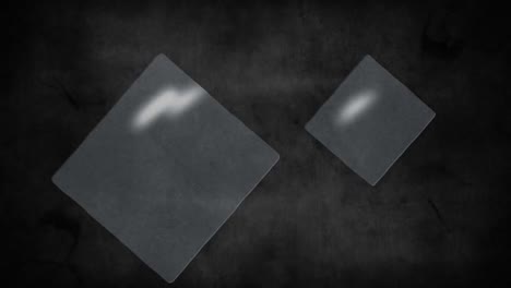 Animation-of-white-on-grey-squares-over-shaking-dark-smoky-background
