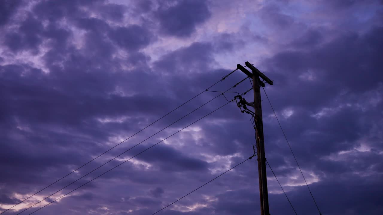 Power pole against cloudy sunset in Canadian town