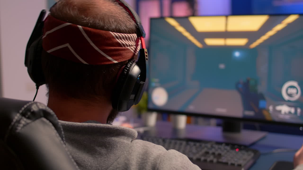 Pro gamer playing on powerful computer shooter video game