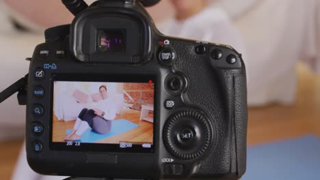 caucasian blogger woman doing a video at home